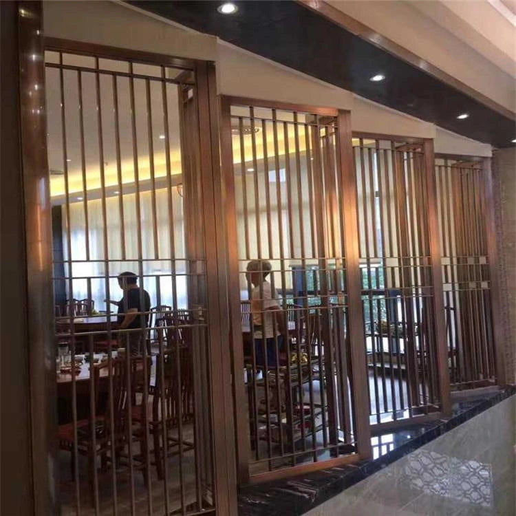 Modern restaurant interior with stainless steel screen as feature divider.