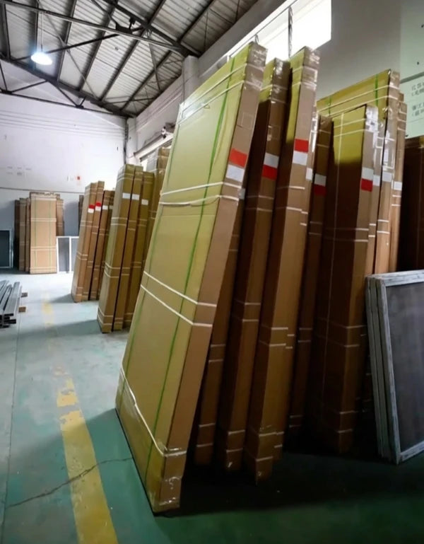 Finished metal screens staged and ready for loading into shipping containers.