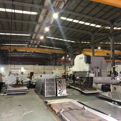 Large scale stainless steel fabrication workshop with 12kW fiber laser cutting machines.