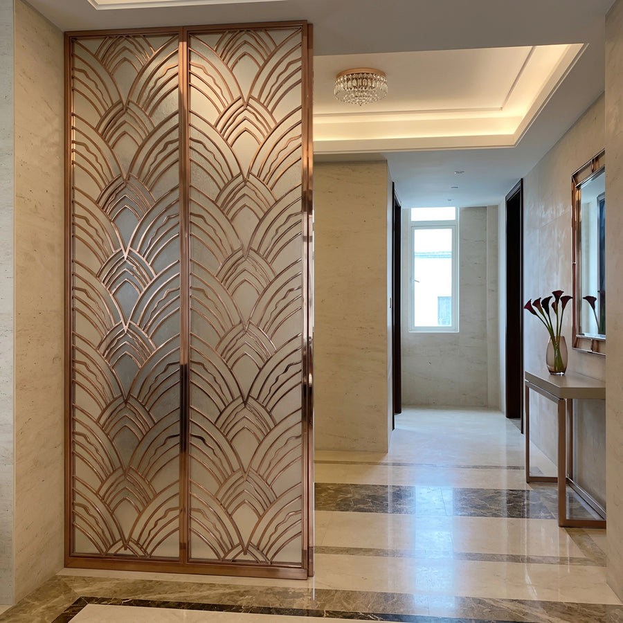 Full-height rose gold PVD entrance partition with an art-deco fan pattern over frosted glass in a villa foyer — visualization