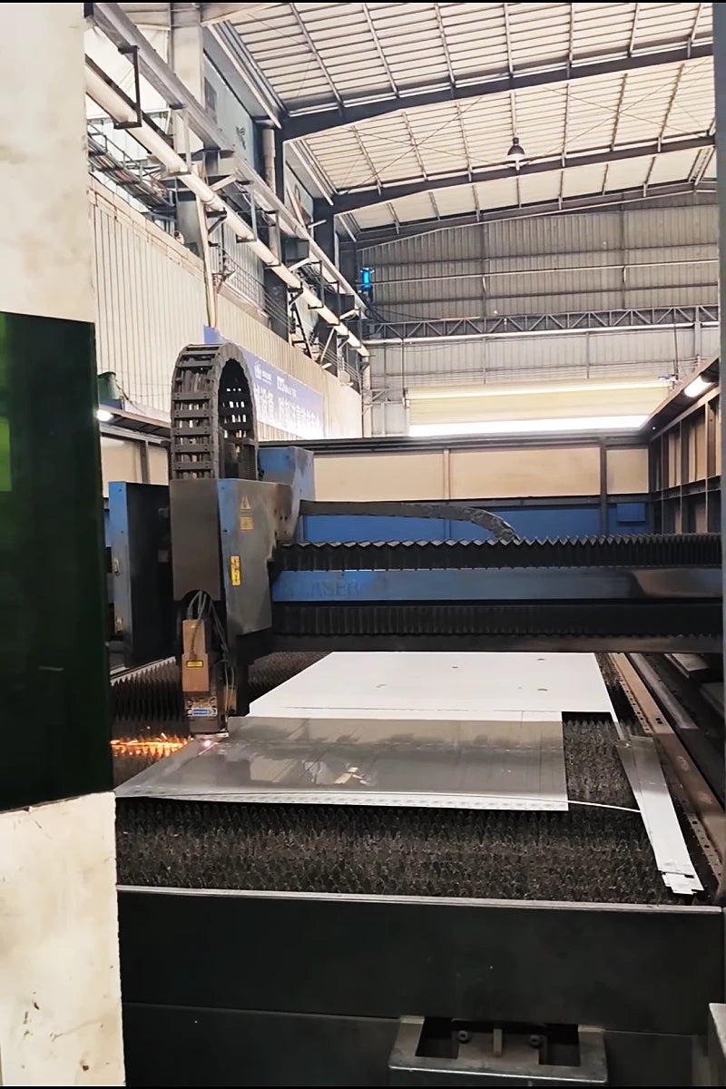 8kW fiber laser cutting machine processing stainless steel screen pattern with high precision and clean edges.